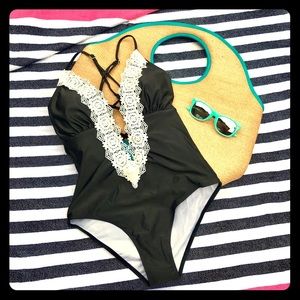 Black one-piece swimsuit with ivory lace